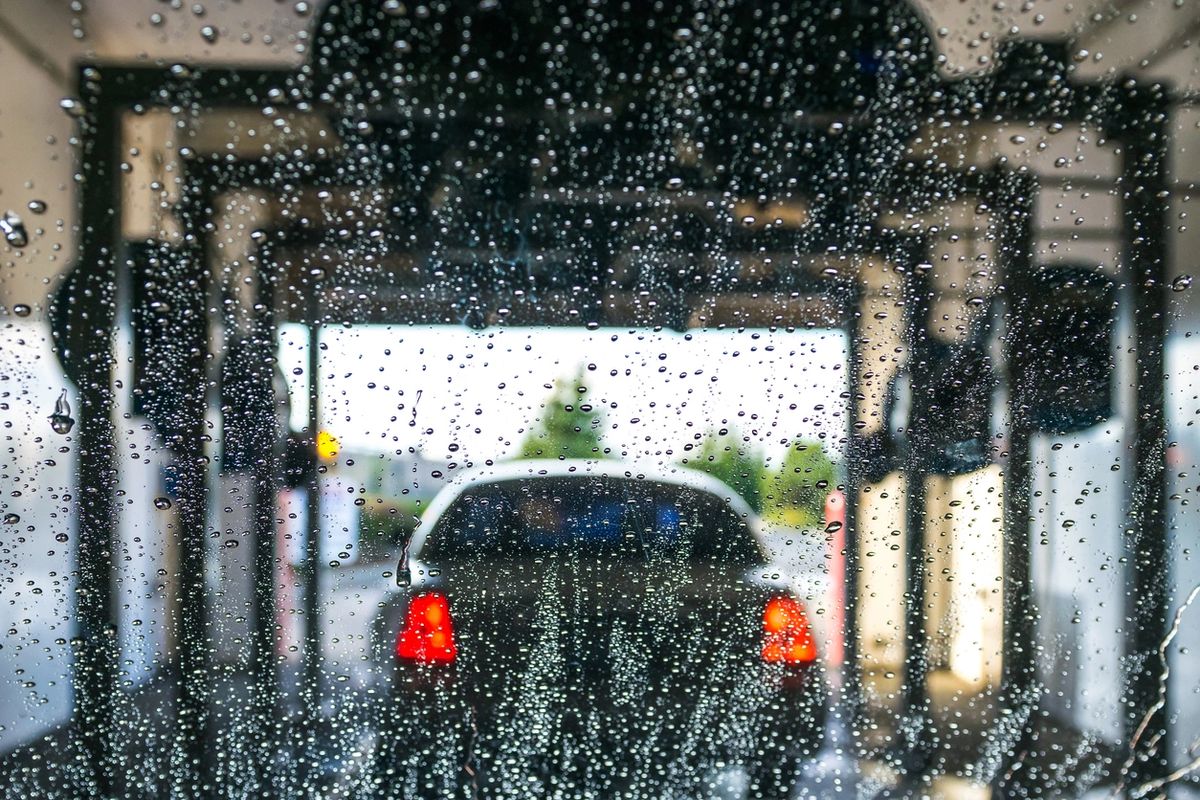 Car moving through a car wash tunnel