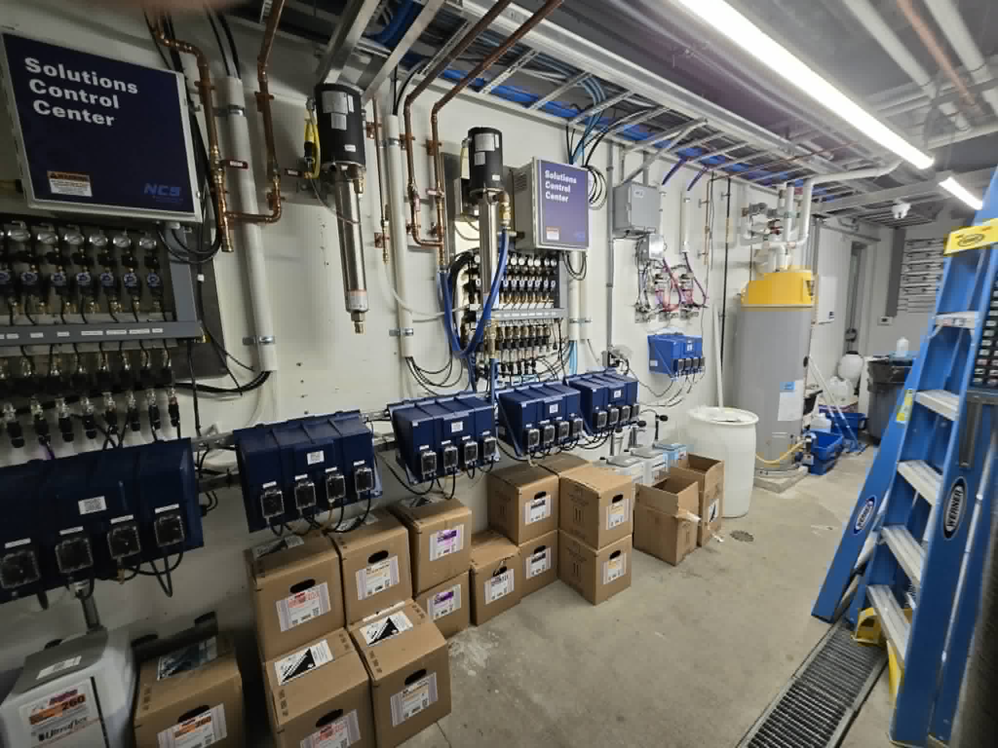 Car wash equipment room build with pumps and dispensers