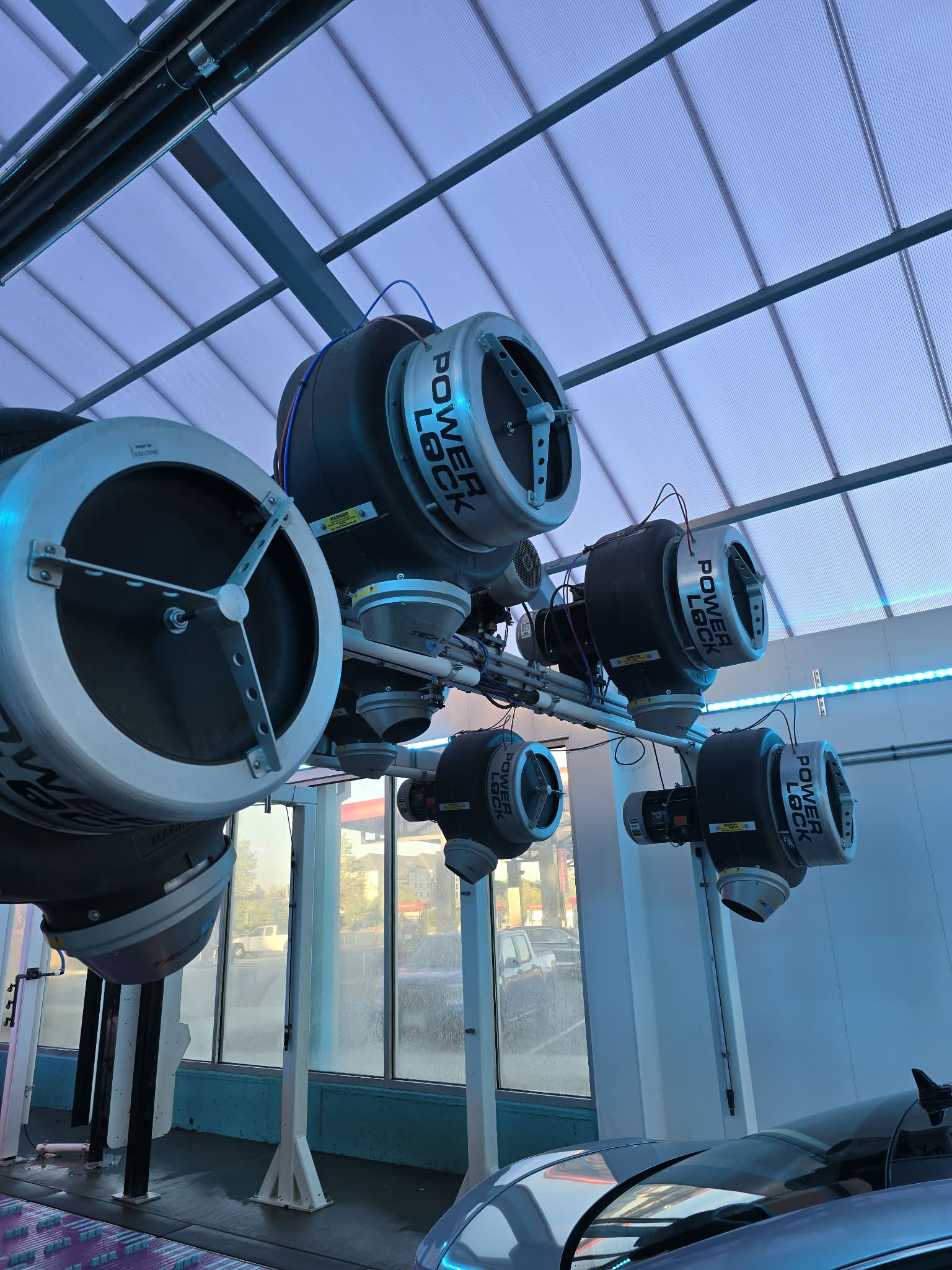 Overhead blower and dryer systems installed in a wash tunnel